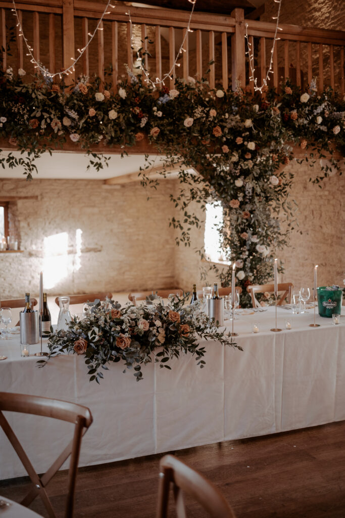 Wedding floral arrangements at Kingscote Barn