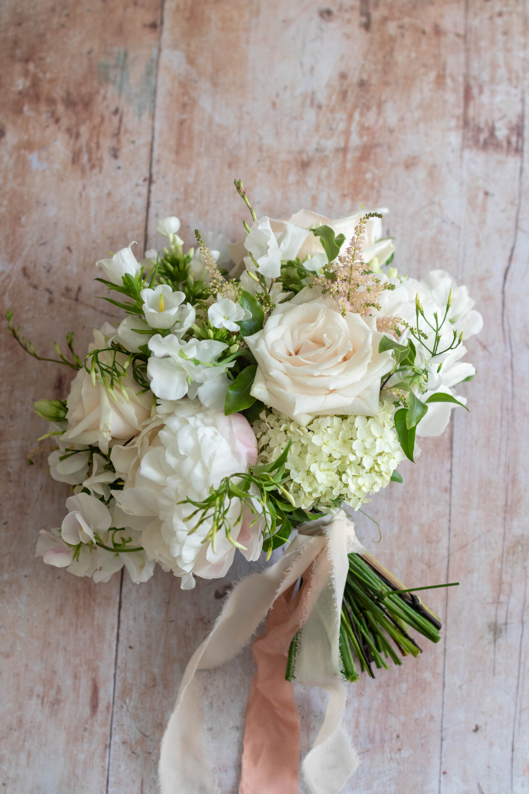 Bridal bouquet with seasonal wedding flowers designed for an intimate wedding
