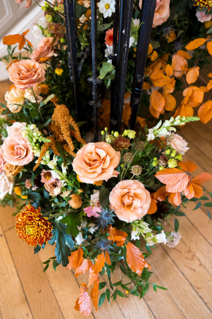 Floral staircase at Eastington Park in nudes, taupe, brown and toffee coloured flowers