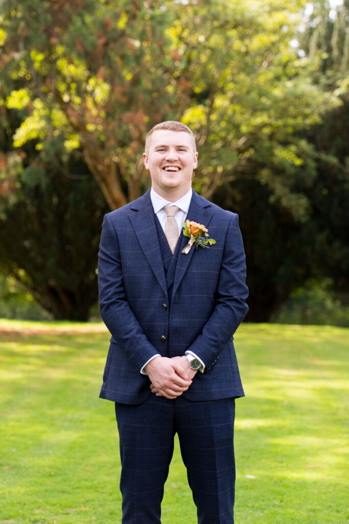 Toffee rose buttonhole for the groom